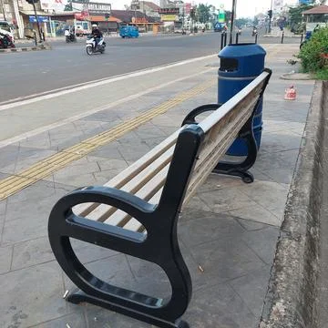 Garden chairs placed on the side of the road Stock Photos