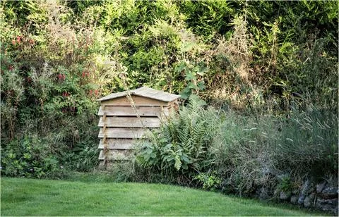 Garden composting bin in the shape of a bee hive Stock Photos