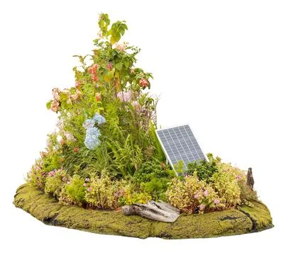 A garden featuring a solar panel at the center surrounded by a variety of pla Stock Photos