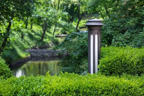 Garden iron lantern with white diffuser of street lighting. Stock Photos