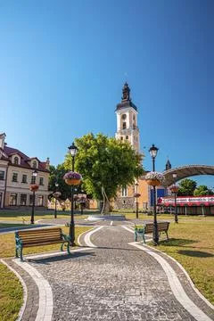 Garden path leading to abstract framework on the center of the street Stock Photos