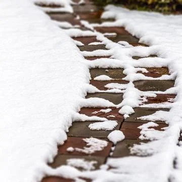 Garden path in the snow Stock Photos