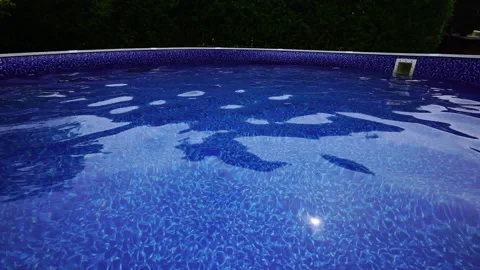 Garden pool with rippling water Stock Footage 130863734