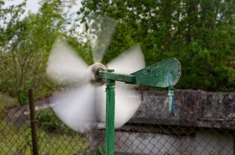 Garden propellers spin in high winds Stock Photos