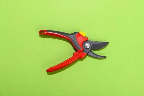 Garden pruning shears on a green background Stock Photos
