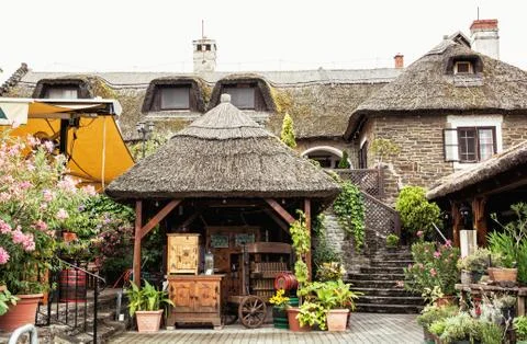 Garden restaurant with thatch in hungarian village, tourist destination Stock Photos