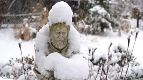 Garden Statue Saint covered in Snow Stock Footage 147565908