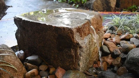 Garden stone water feature Stock Footage 76562407