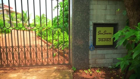 Garden surrounds entryway with name plate Stock Footage 297241237