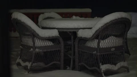 Garden table and chairs covered with snow. Stock Footage 236014712
