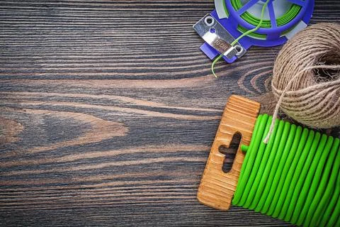 Garden tie wire hank of string on wooden board gardening concept Stock Photos