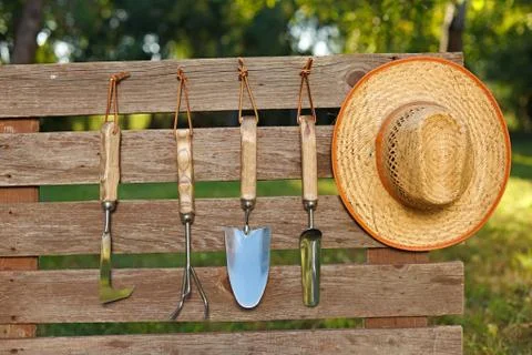 Garden tools on board fence Stock Photos