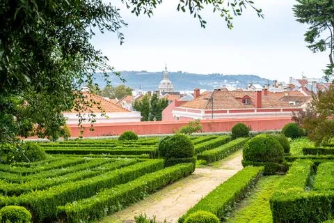 Garden view with rooftops and distant dome in Belem, Lisbon, Portugal Stock Photos