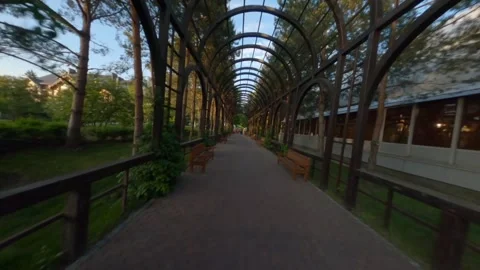 Garden, Walking in vegetable tunnel, Tracking shot along path beneath arches at  Stock Footage 269067059