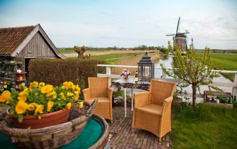 Garden with windmill Stock Photos