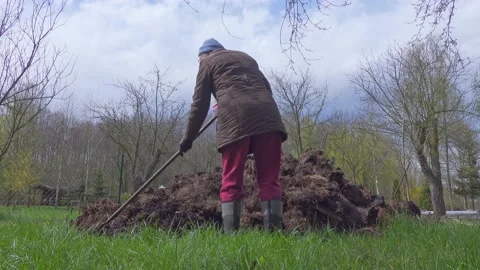 Garden work with compost. Stock Footage 154771726