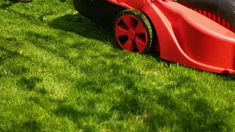 Garden worker with lawn mover Stock Footage 201472710