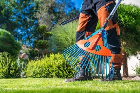 Garden Worker with Plastic Modern Rake in His Hands Fotos Stock
