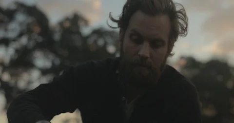 Gardener checking organic vegetable crops at sunrise Stock Footage 76404773