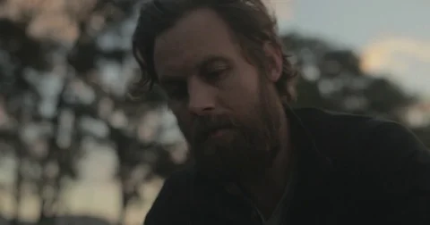 Gardener checking organic vegetable crops at sunrise Stock Footage 76404811