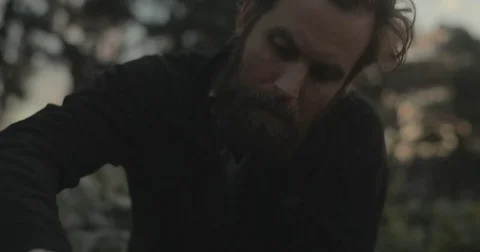 Gardener checking organic vegetable crops at sunrise Stock Footage 76404812