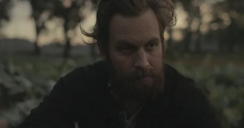 Gardener checking organic vegetable crops at sunrise Stock Footage 76404856