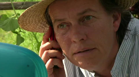 Gardener speaking in cellphone Stock Footage 511782