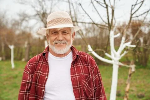 Gardener standing, looking at camera, smiling. Stock Photos
