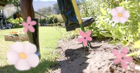 Gardener stomping fork using right-foot at bed edge, loosening soil, pink Stock Footage 330423540