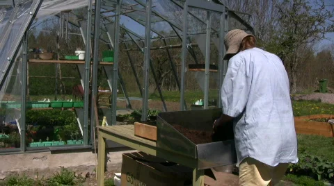 Gardener working with plants Stock Footage 515564