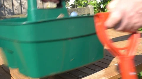 Gardening tools being placed into a plastic container. Stock Footage 89793887