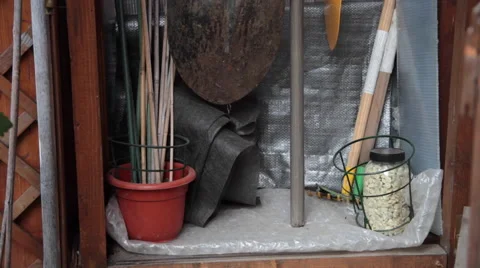 Gardening tools in tool shed, rake fork spade and shovel Stock Footage 51677995