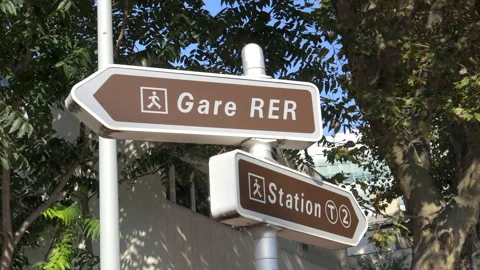 Gare RER and Station T2 signs near the regional train and tram station in Paris Stock Footage 256973671