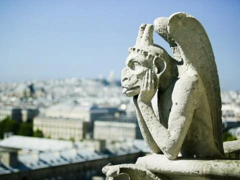 Gargoyle atop building Stock Photos