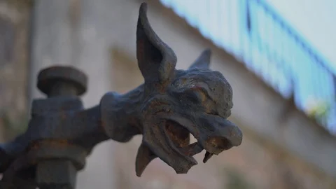 Gargoyle head made of metal. wall mount torch holder. Stock Footage 115159201