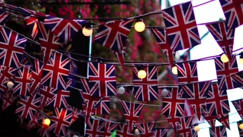 .Garland of British flags on a street during UK celebration, festive atmosphe Stock Footage 284524845