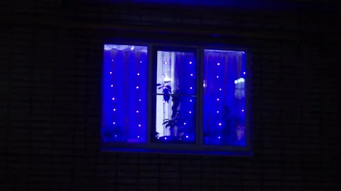 A garland is burning in the window Stock Footage 159881557