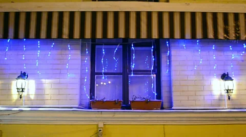 Garland on decorated window, modern technology, illumination Stock Footage 34737191