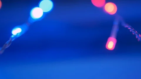 Garland hangs in front of window creating festive mood Stock Footage 125414076