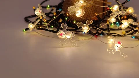 Garland lights on a light background 動画素材 322680098