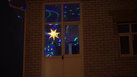 Garland in the window Stock Footage 163567632