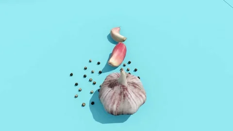 Garlic and Pepper on Blue Surface Stock Footage 320828072