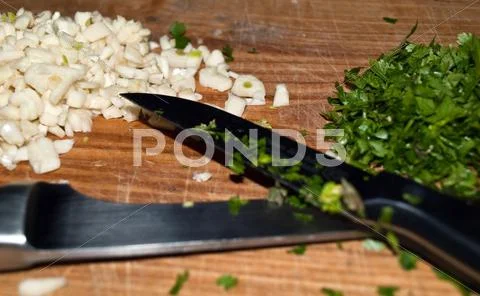 Garlic and persley Stock Photos