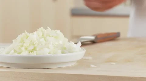 Garlic being added to finely chopped onion Stock Footage 24636233