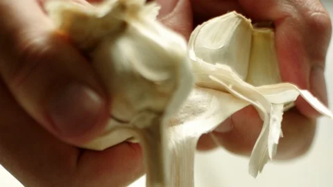 Garlic being broken apart  Stock Footage 120573101