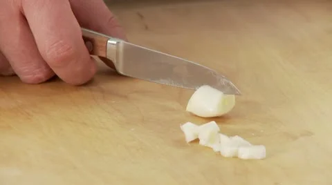 Garlic being chopped Stock Footage 24636991