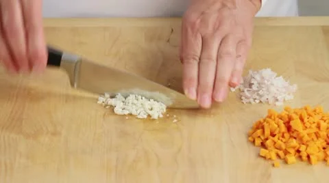 Garlic being finely chopped Video stock 24667109