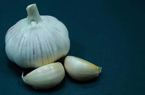 Garlic on black background Stock Photos