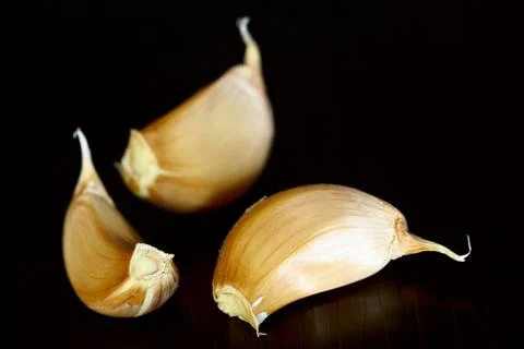 Garlic on black Stock Photos