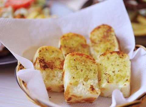 Garlic bread with herbs Stock Photos